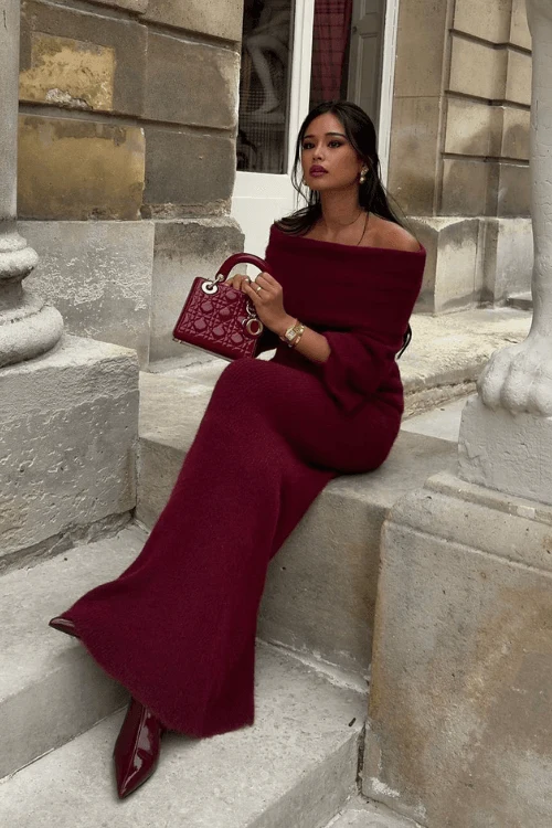 An off-shoulder maxi dress is the epitome of winter chic. Add some sparkle with statement earrings and pair it with heeled ankle boots for a warm yet sultry vibe. Throw on a long coat, and you’re ready to conquer a chilly evening in style. Recreate This Look