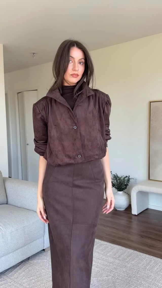 black off-the-shoulder long-sleeve top, chocolate brown suede maxi skirt, black pointed-toe knee-high heeled boots