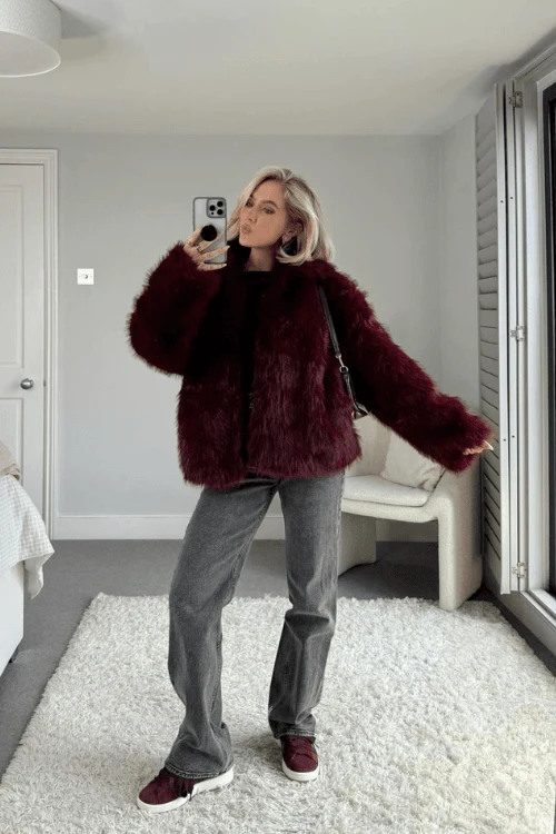 Classic denim paired with a plush fur jacket is a match made in style heaven. Complete the look with knee-high boots and a bold red lip for that effortlessly cool winter aesthetic. A crossbody bag will elevate this look even further. Recreate This Look