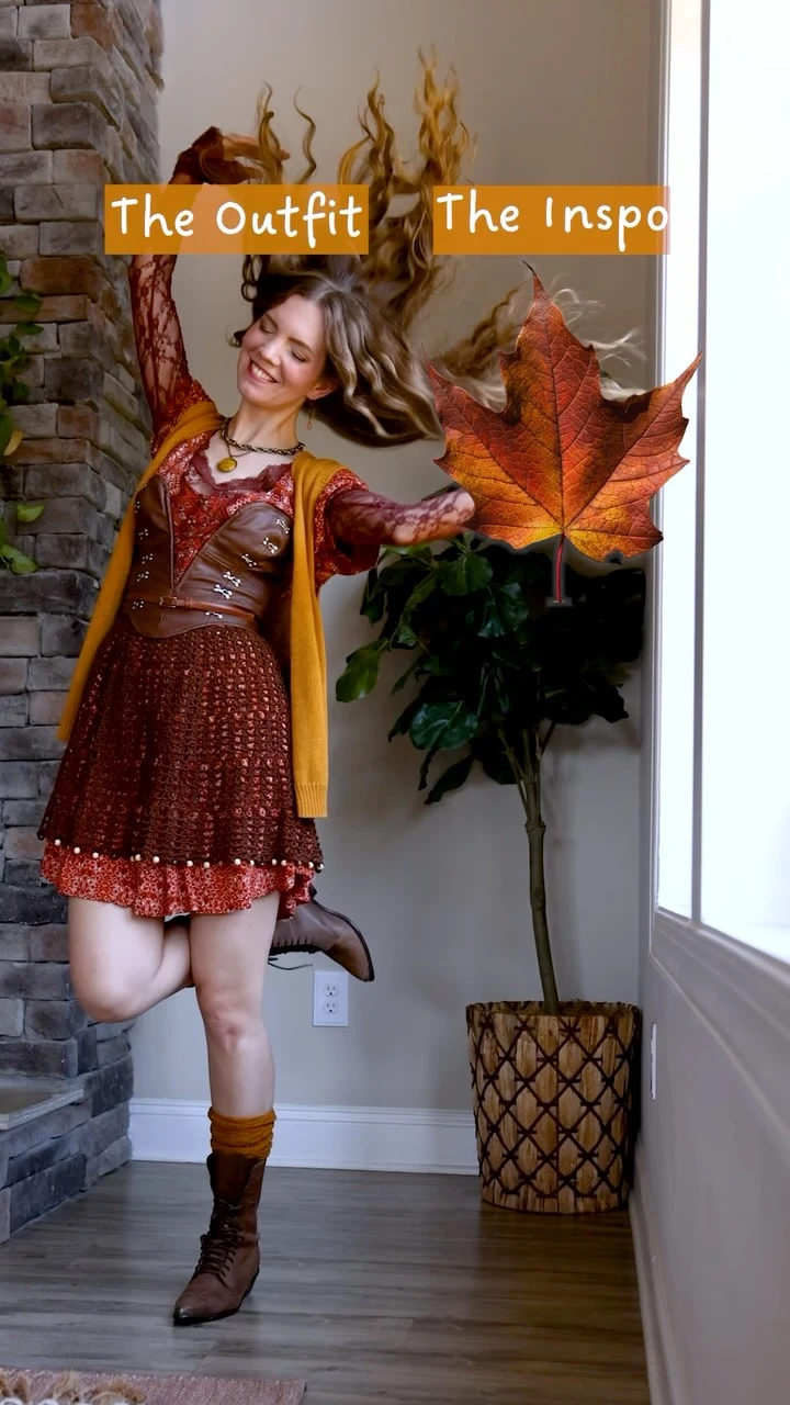 Rust mini dress with mustard cardigan draped over shoulders and brown knee-high lace-up boots.