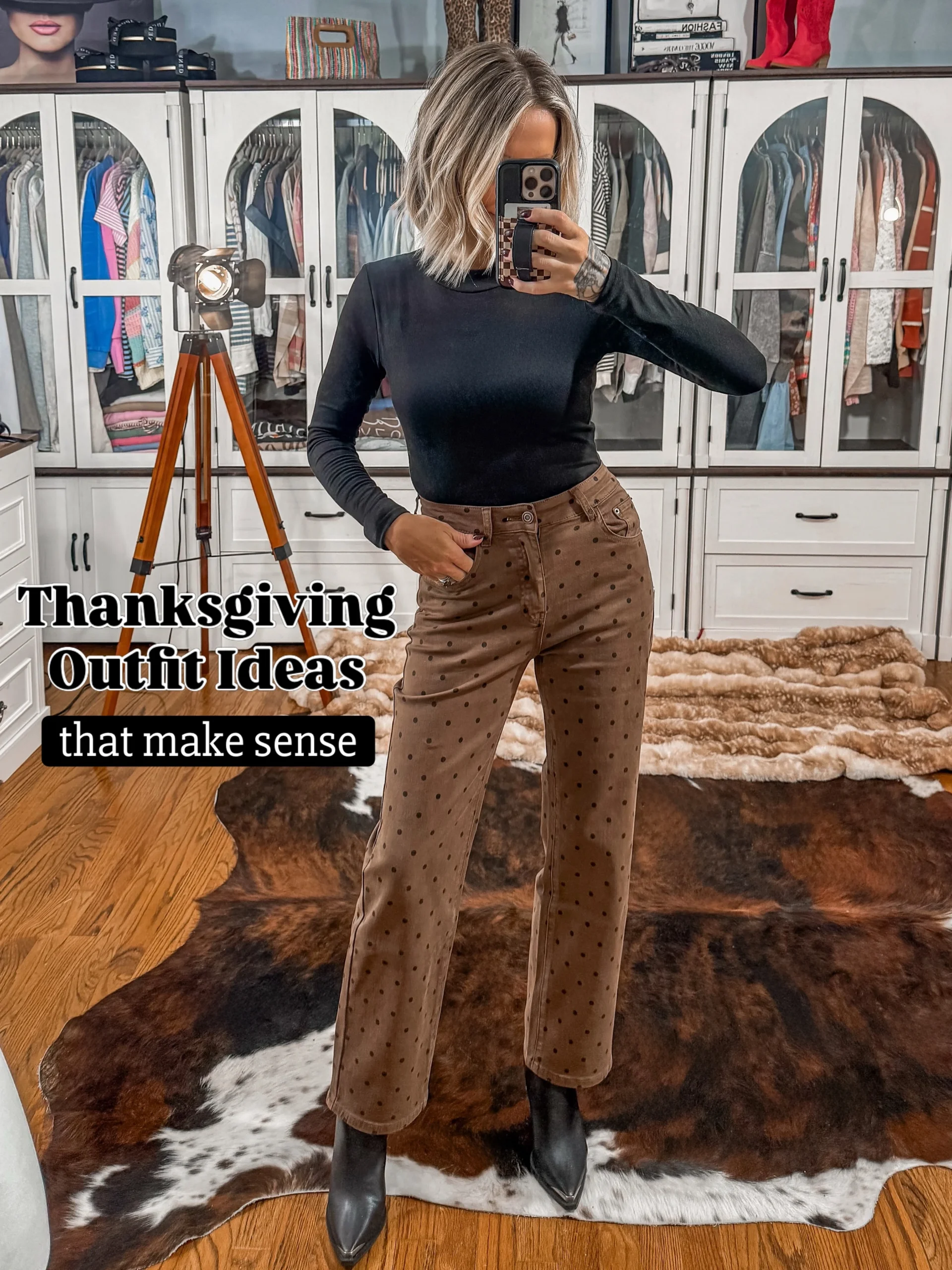 Fitted black long-sleeve top with high-waisted brown dotted straight-leg pants and black ankle boots.