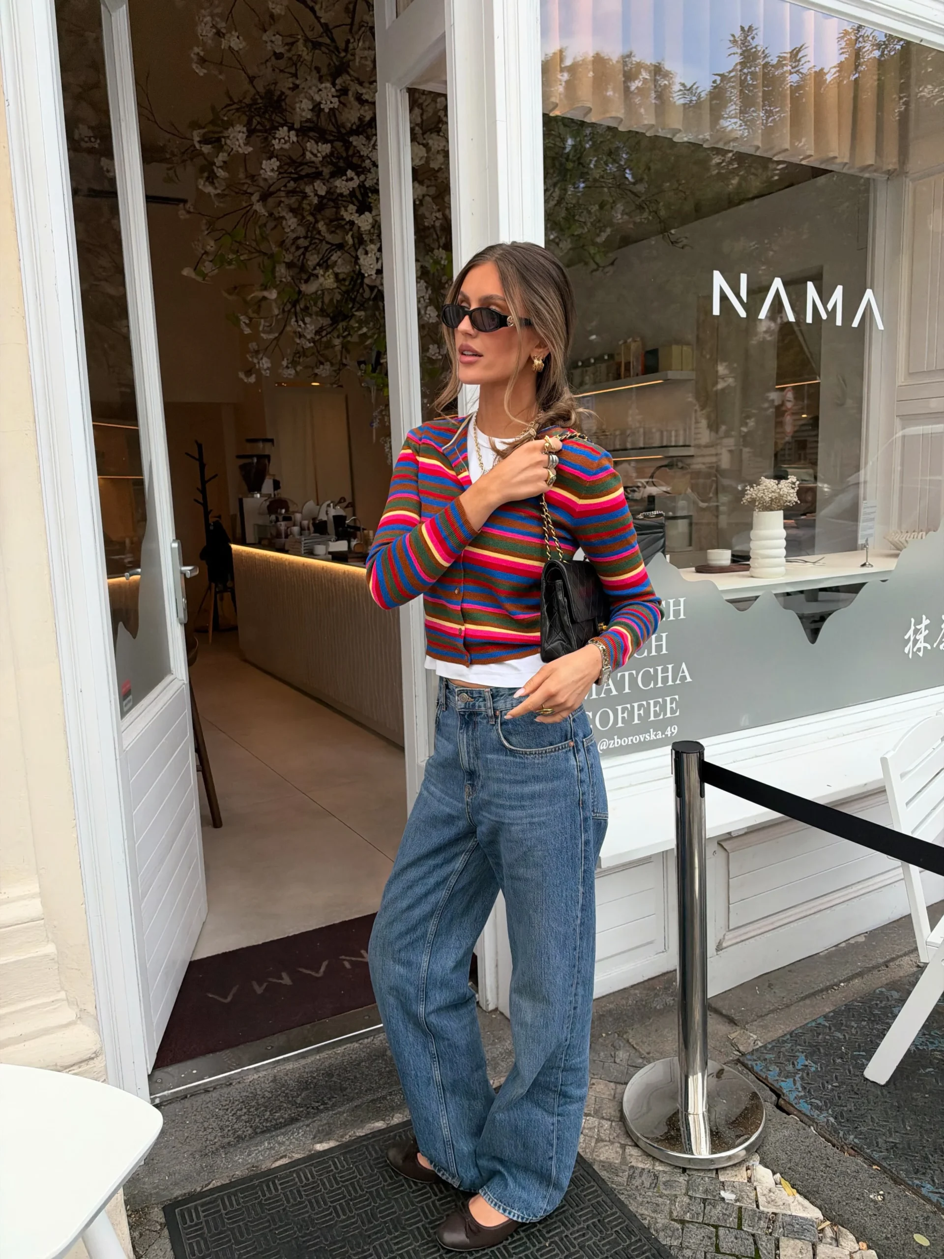 Multicolor horizontal striped cropped cardigan over white t-shirt, light wash wide leg jeans