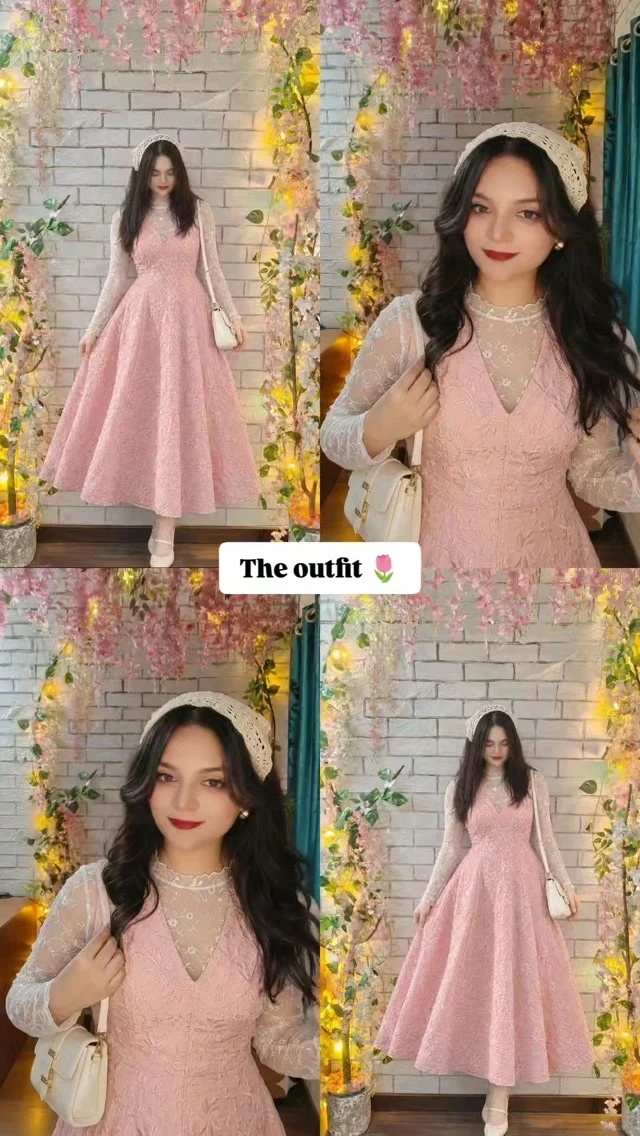 Woman in a pale pink flared dress layered over a sheer lace top with a cream lace head covering.