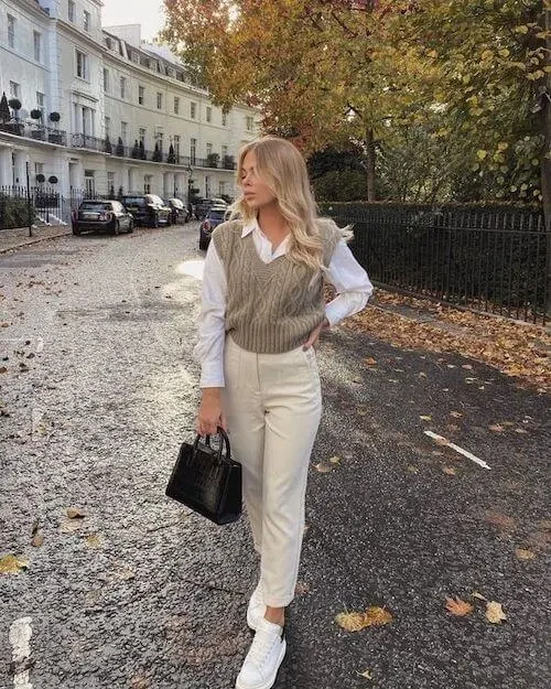 Stay snug and stylish with a cozy knit sweater vest paired with pants. This ensemble is perfect for a relaxed yet chic look, ideal for both lounging at home and casual outings.