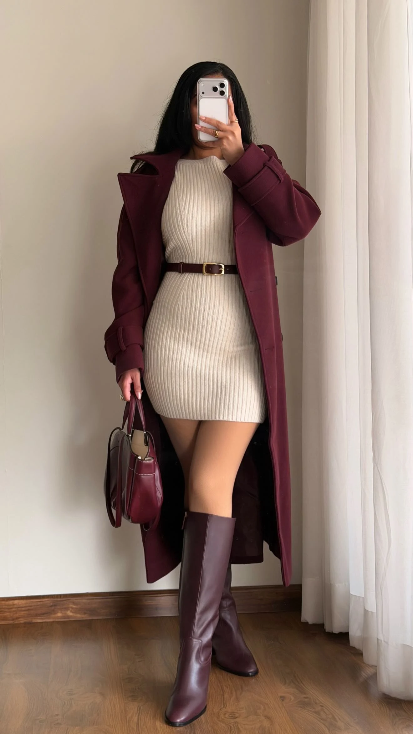 cream ribbed knit dress, chestnut brown leather belt, chestnut brown knee high boots, burgundy trench coat