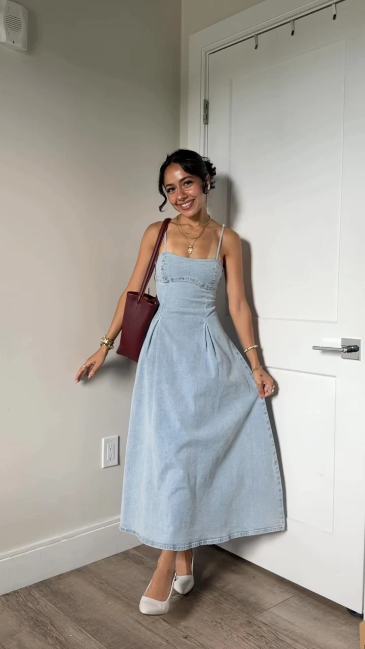 Woman in a light-wash denim spaghetti-strap midi dress with white pointed-toe slingback heels.