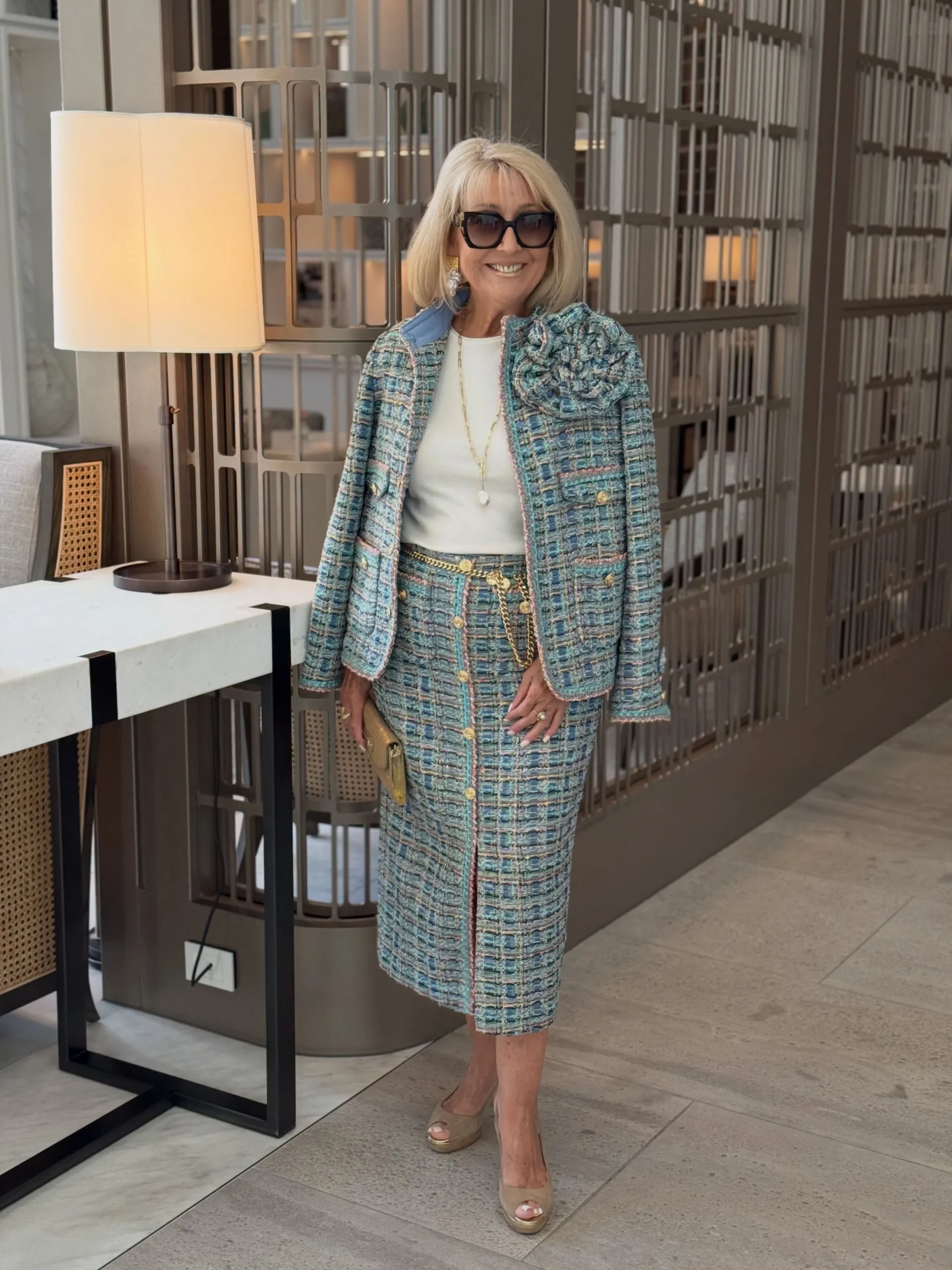 Blue teal and cream checked matching jacket and midi skirt set with beige open-toe heels.