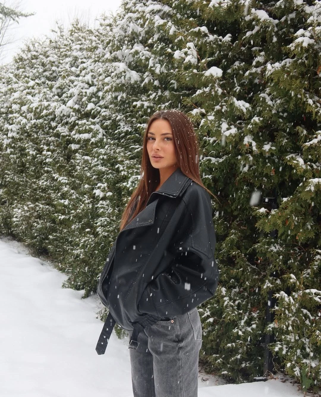 Long black coat, black mini dress, black tights, black boots