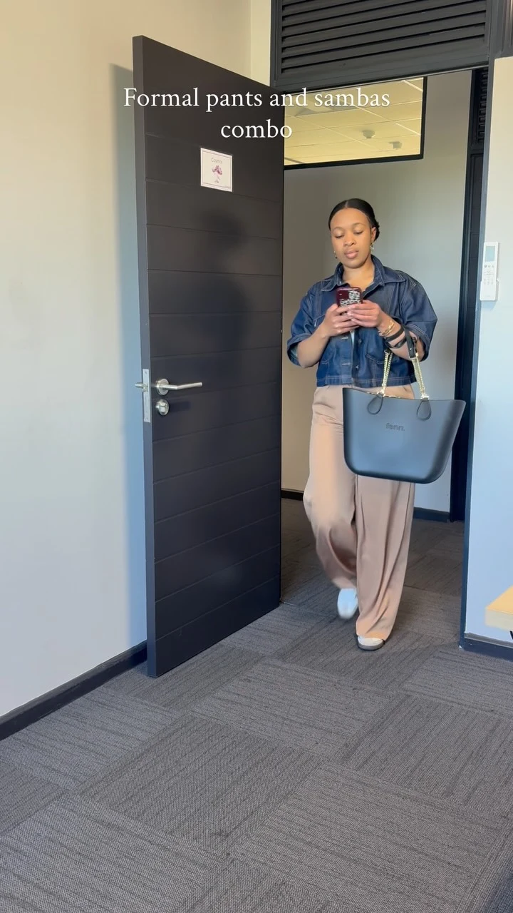 Striped cardigan and white wide-leg trousers styled with white Sambas and a large black tote.
