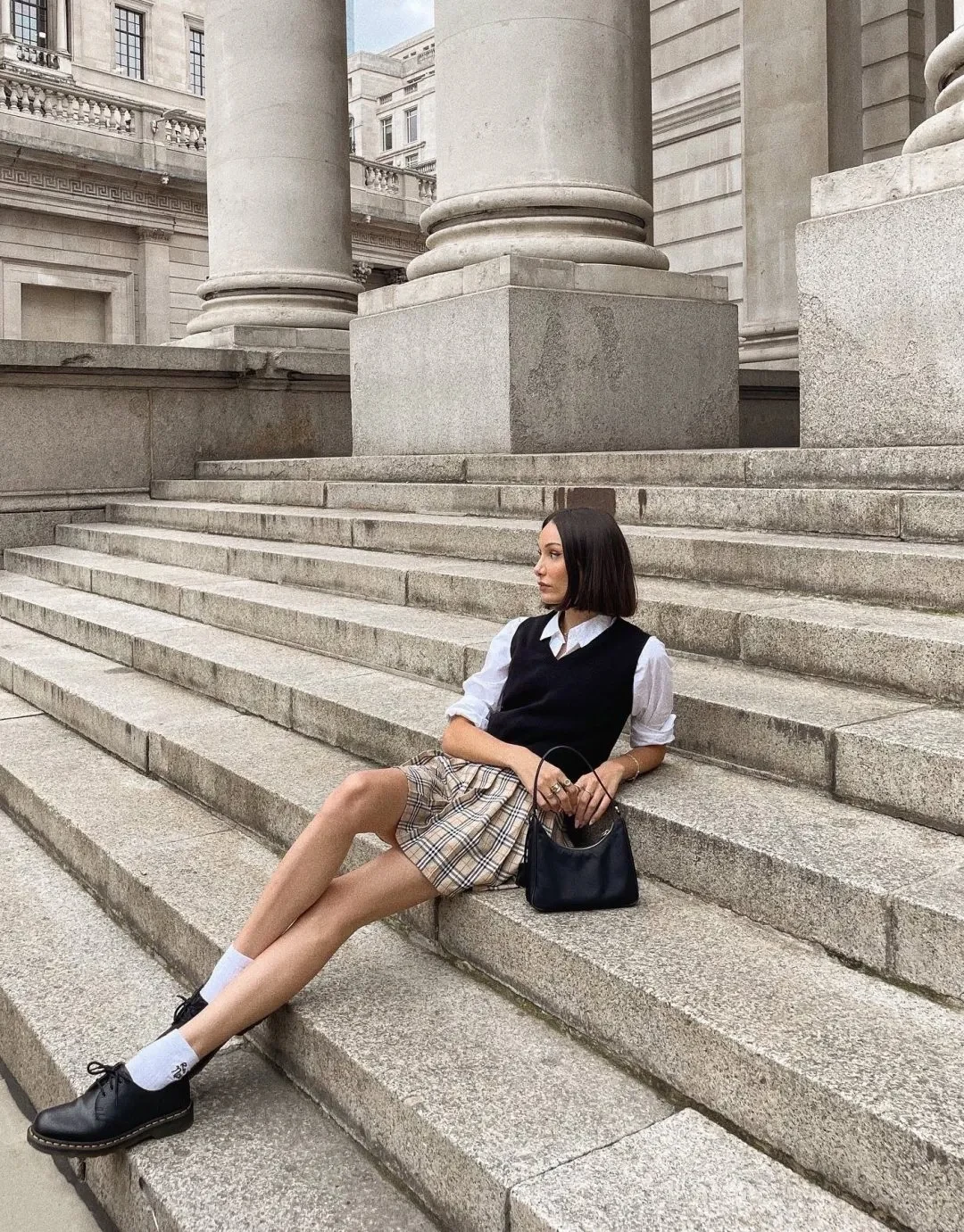 Source: Instagram Channel your inner schoolgirl with a preppy plaid skirt and a black sweater vest. This classic combo is timeless and charming, perfect for a cute and polished outfit.
