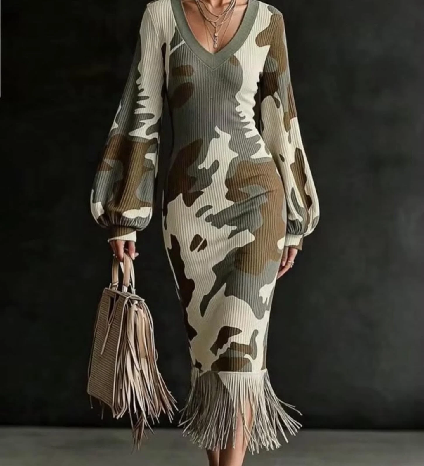 Fitted camouflage ribbed midi dress with balloon sleeves, fringe hem, and matching beige fringe handbag.