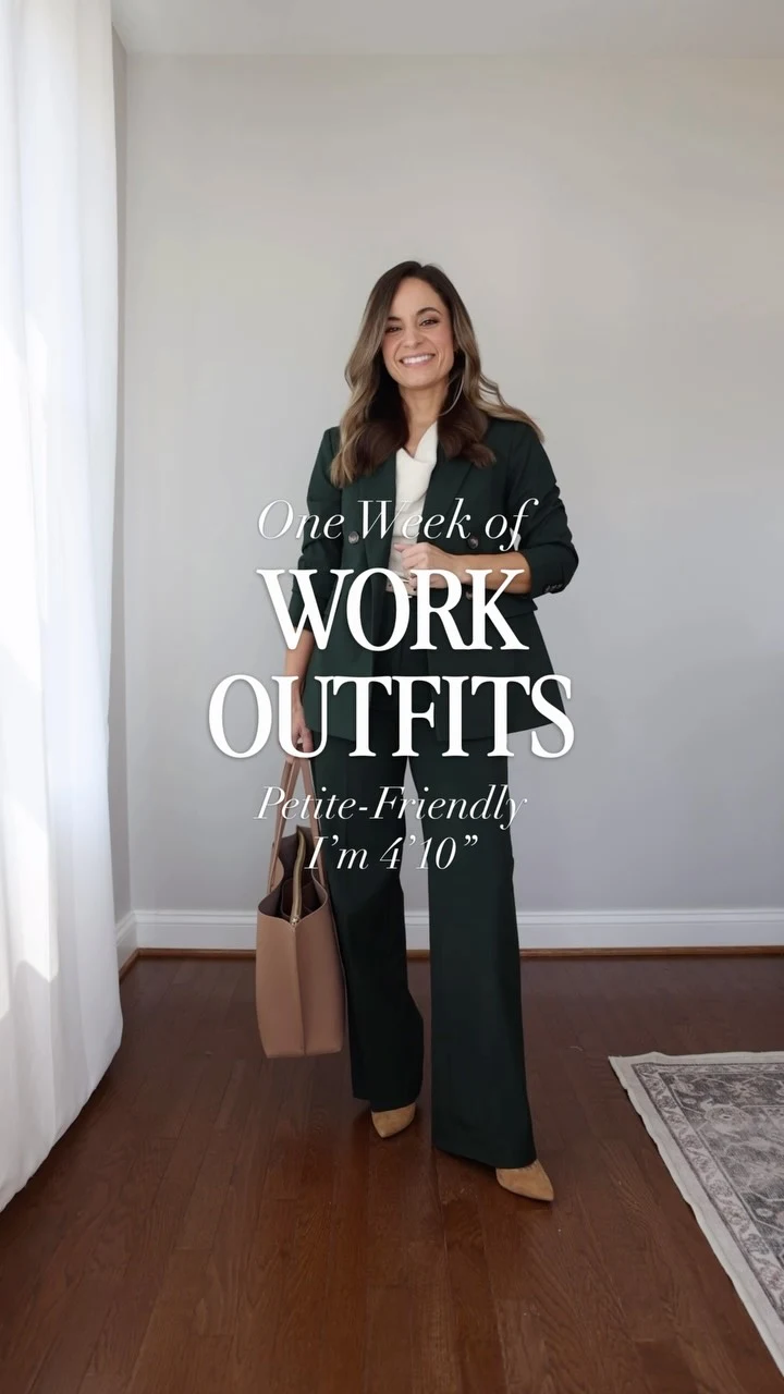Dark green matching blazer and trousers worn over a white crew-neck top for a petite work outfit.