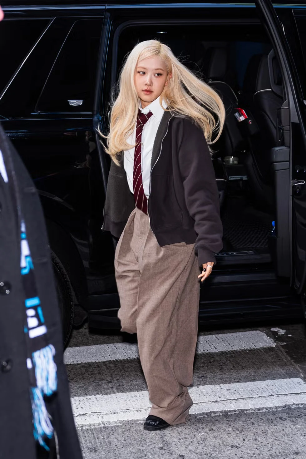Rose wearing a structured coat and slim trousers while out in New York City.