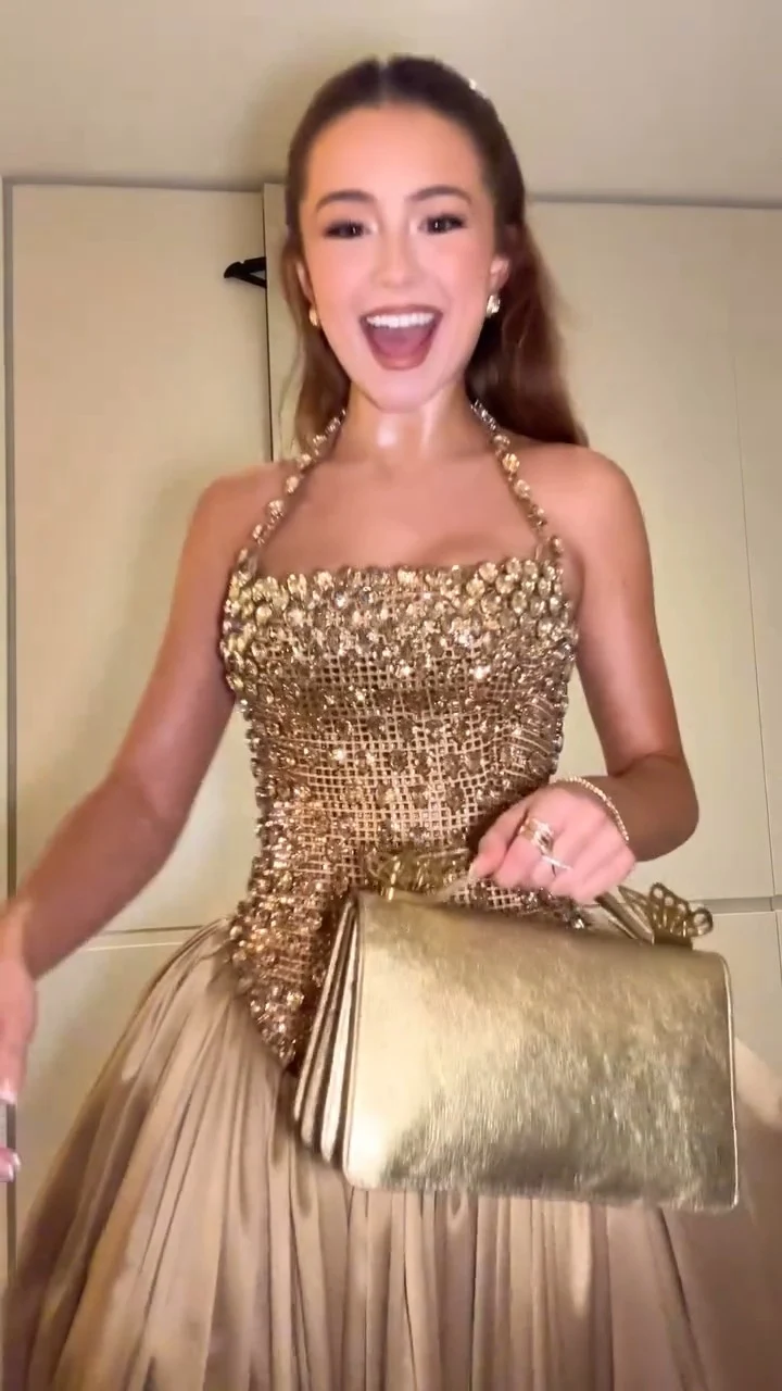 Champagne-gold strapless ballgown with heavily beaded crystal corset bodice, halter illusion and voluminous pleated satin skirt