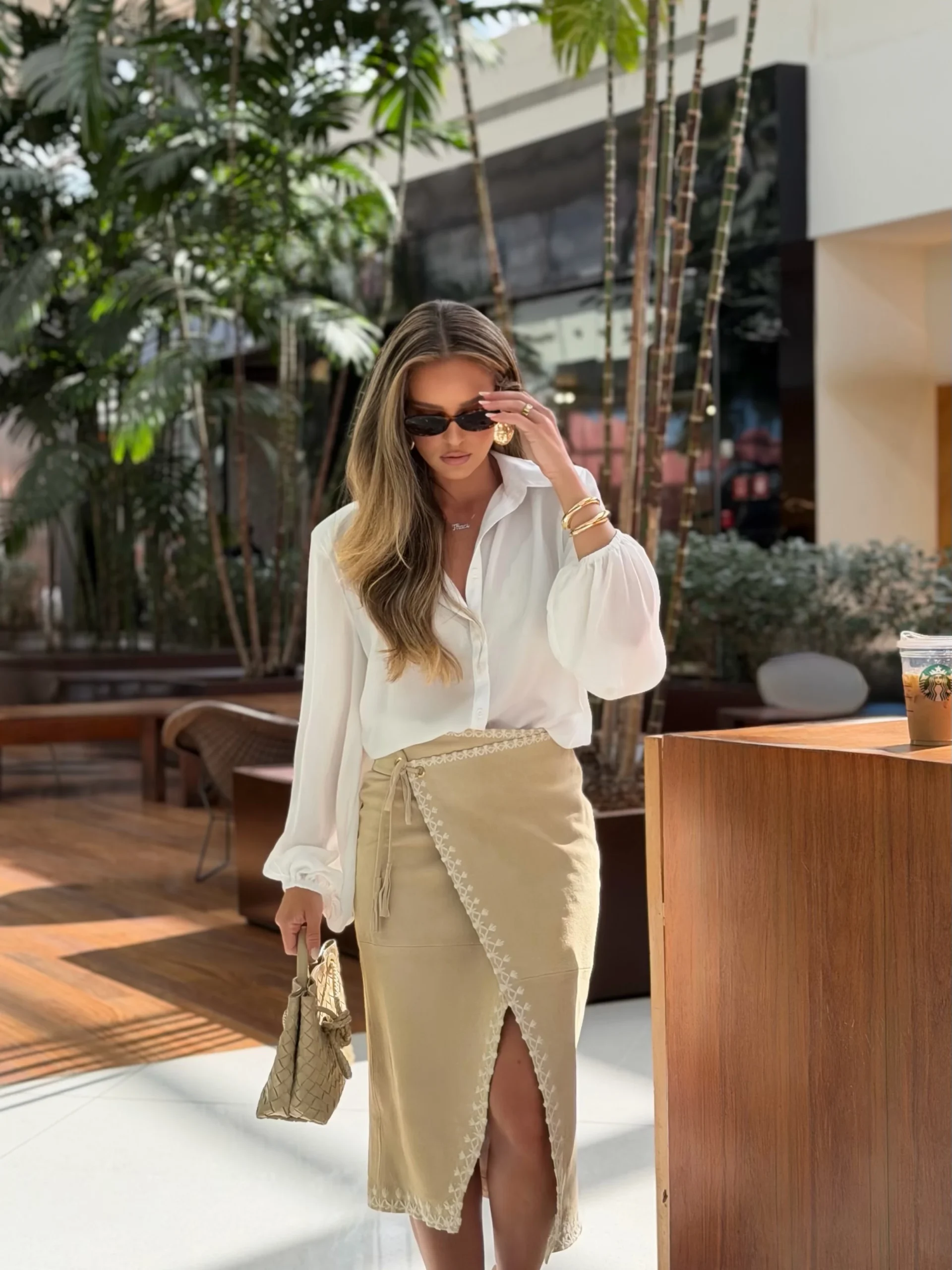 beige long-sleeve top, tan suede mini skirt, nude heels