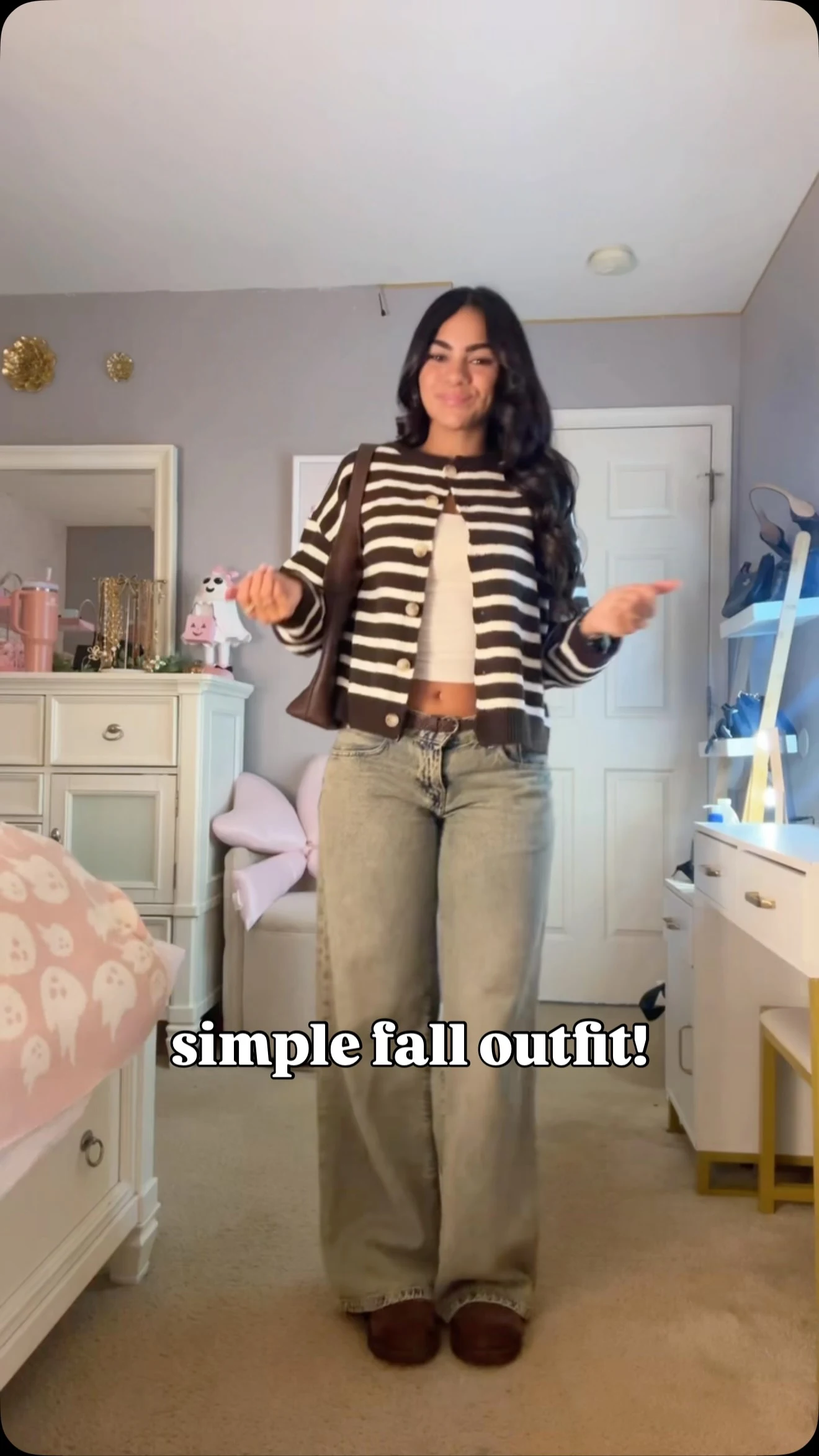 Brown and white horizontally striped button-up cardigan over white cropped tank top, light-wash wide-leg jeans, brown platform boots and large brown shoulder bag