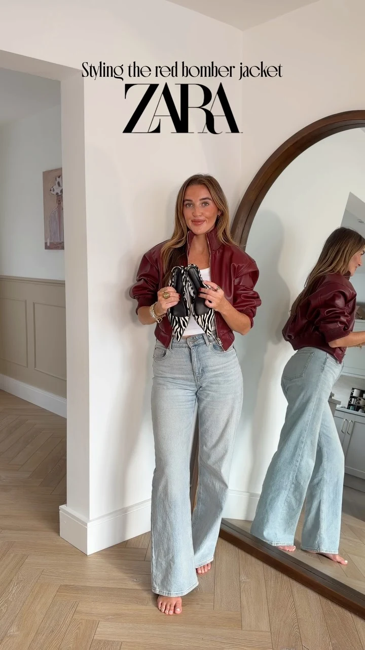 red leather bomber jacket from Zara, white ribbed tank top, light-wash wide-leg jeans, zebra-print pointed-toe heels, small black handbag, small oval sunglasses