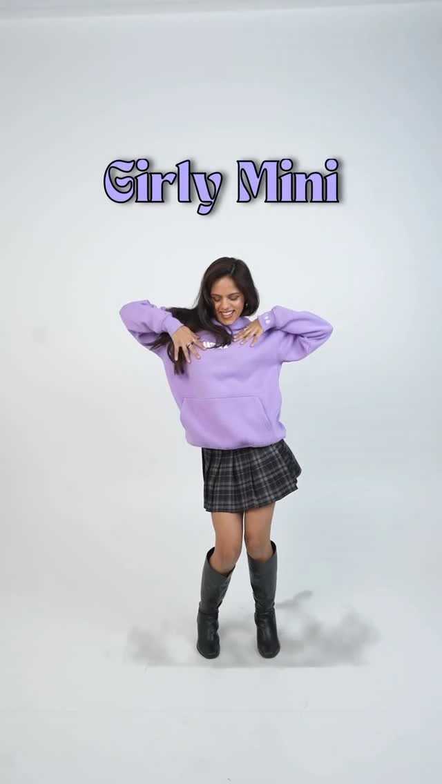 oversized lavender hoodie, black plaid mini skirt, black knee-high boots