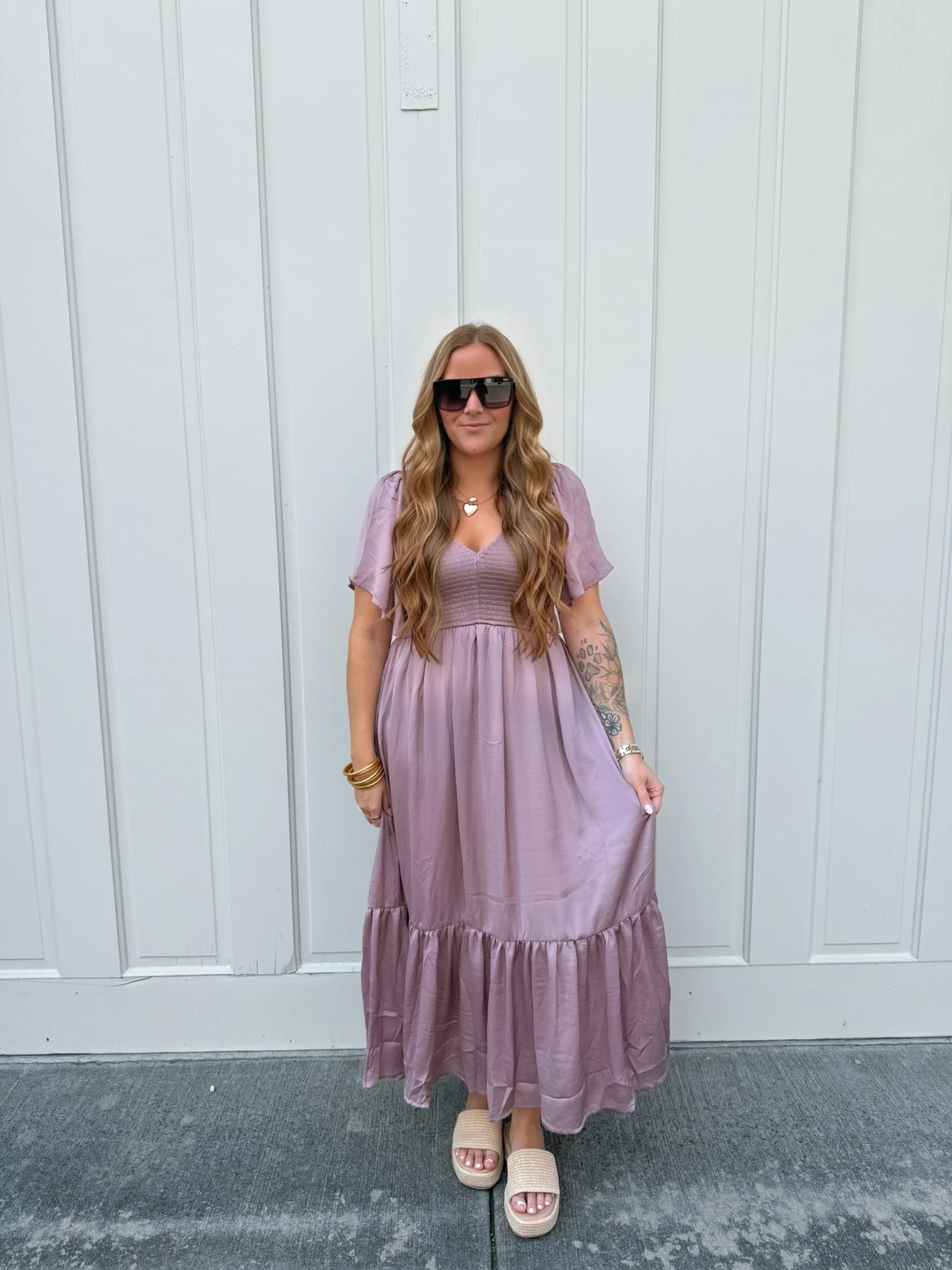 Plum midi dress with smocked V-neck bodice, short flutter sleeves, tiered ruffled hem, light platform slide sandals