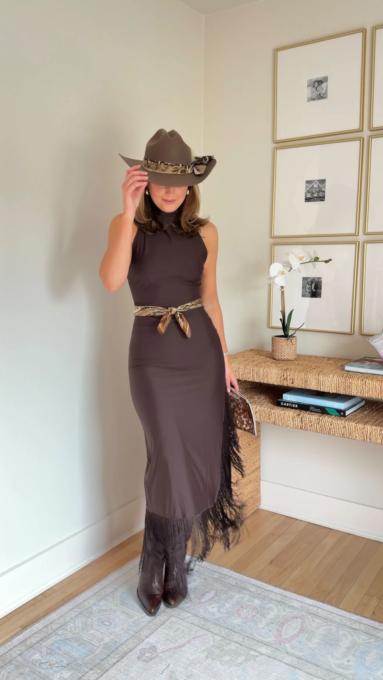 Sleeveless brown maxi dress with fringe hem, brown cowboy hat