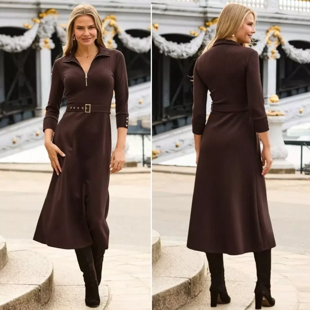 Brown cable-knit sweater dress cinched with a black belt and styled with black knee-high boots.