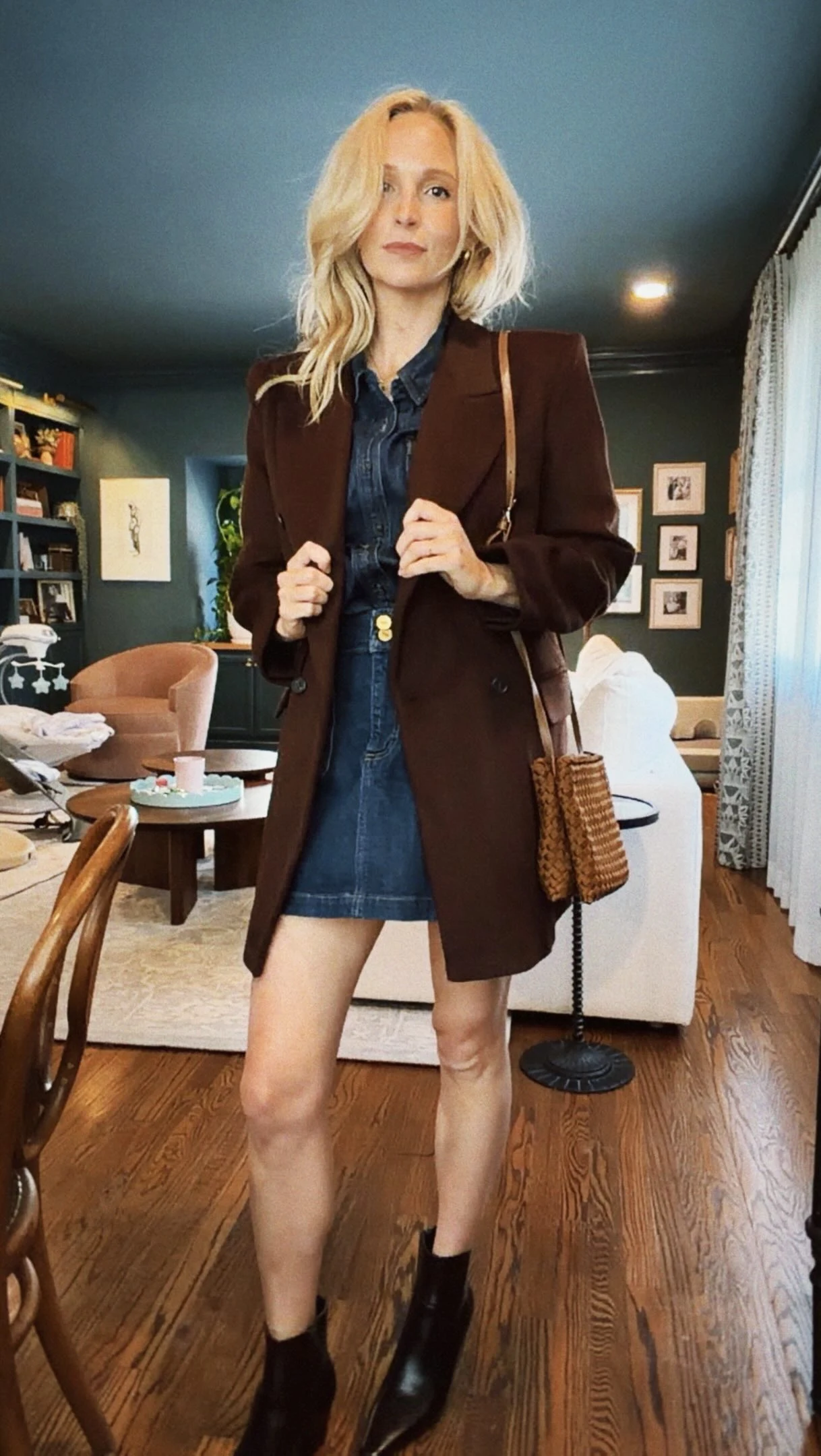 Dark denim shirt dress with rolled sleeves and black pointed-toe ankle boots.