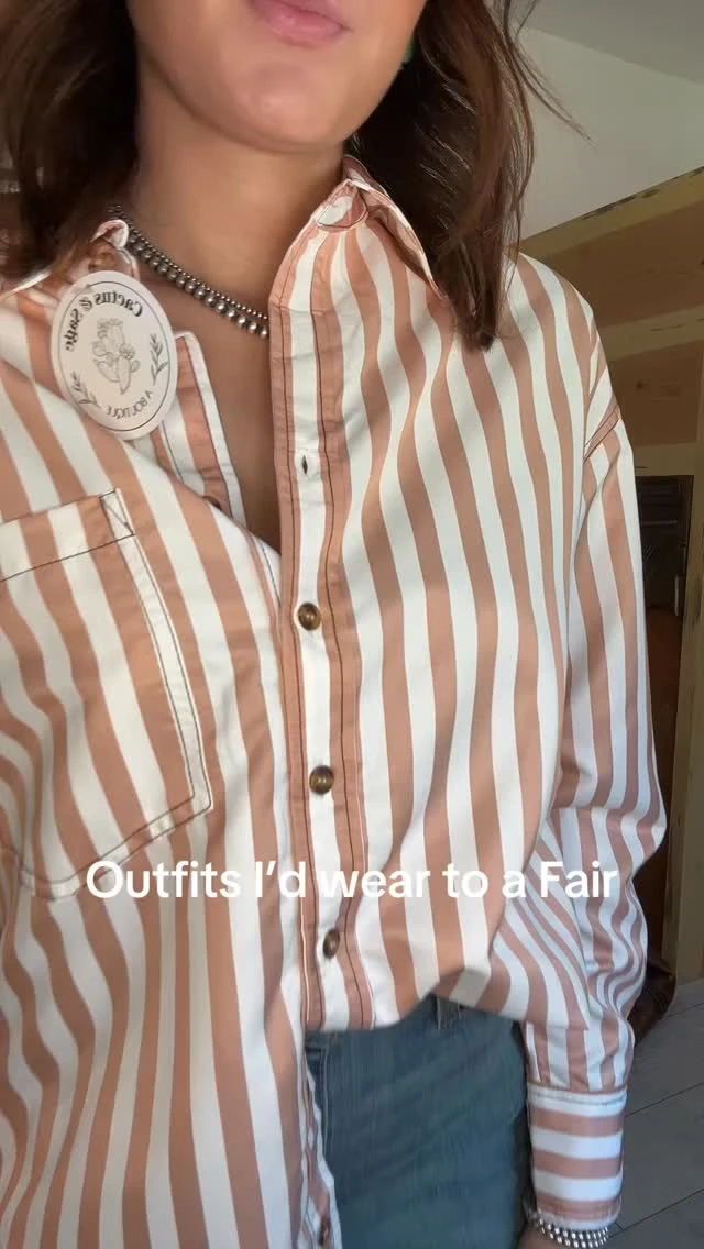 Person wearing an oversized orange and white striped button-up shirt with light-wash flared jeans.