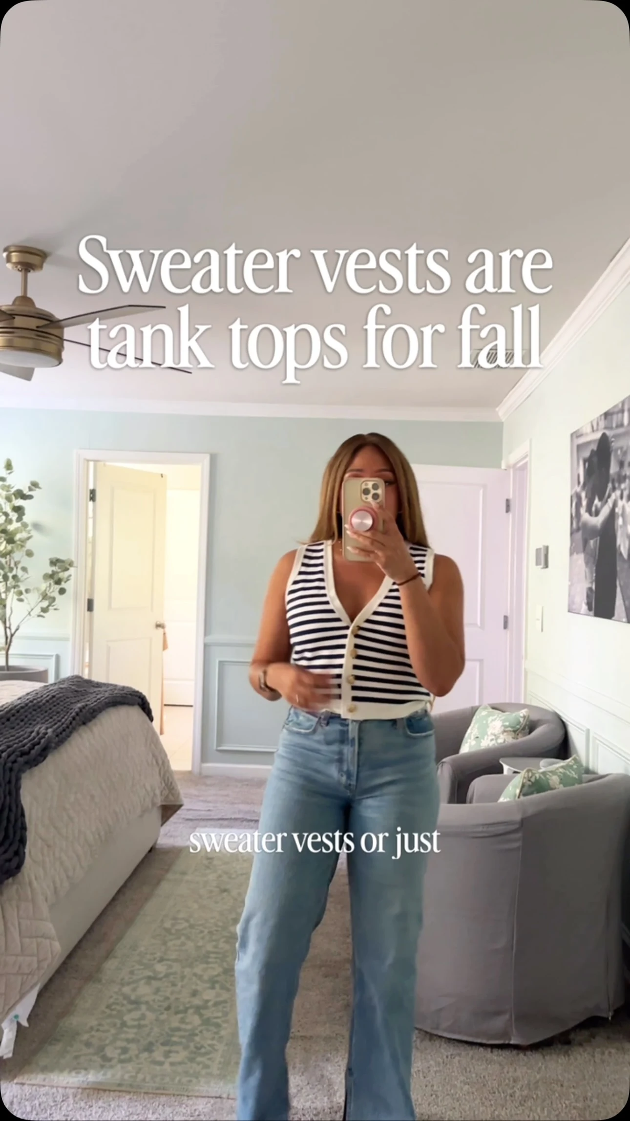 Black and white horizontally striped sleeveless button-front sweater vest, light-wash wide-leg jeans, tan strappy sandals
