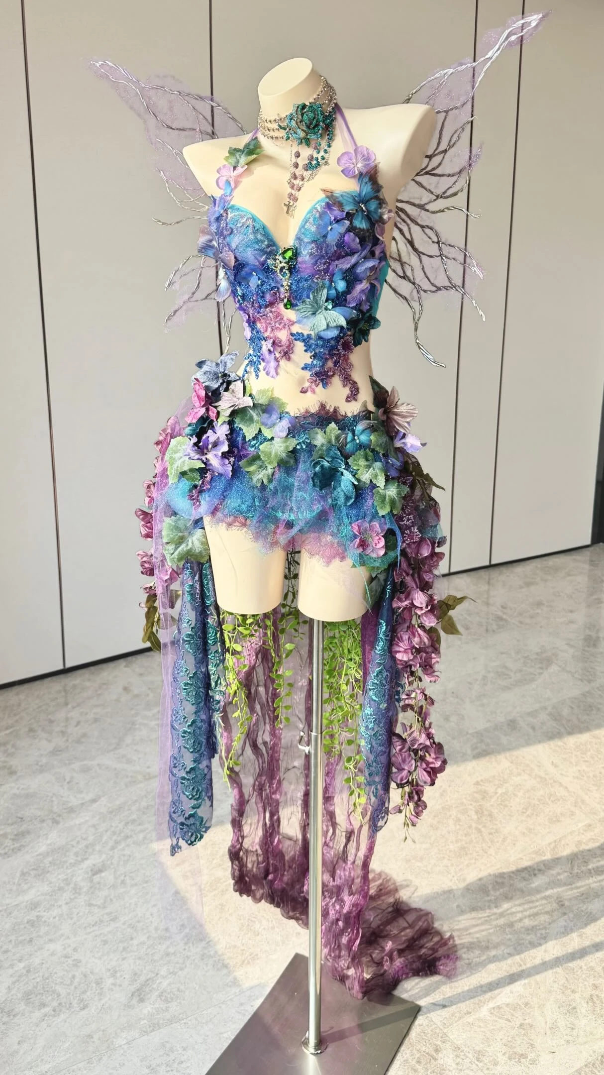 Halter bodice and short skirt made from layered blue, teal, and purple fabric in an ombre effect.